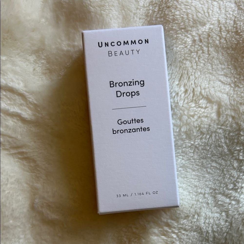 Uncommon Beauty Bronzing Drops in White Packaging